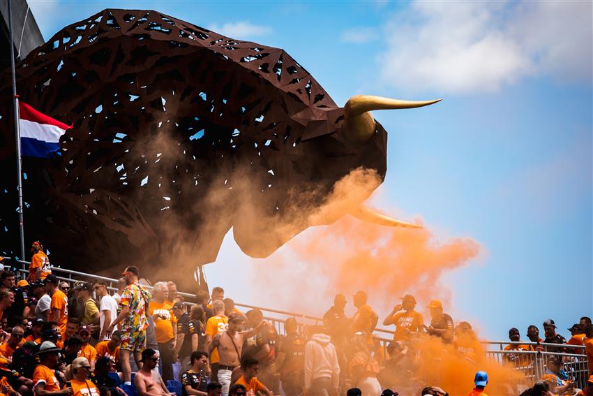 Red bull statue with orange smoke